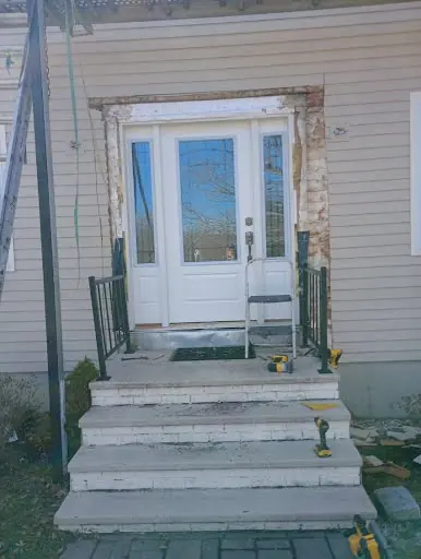 Front entry surround prepared during custom exterior trim installation