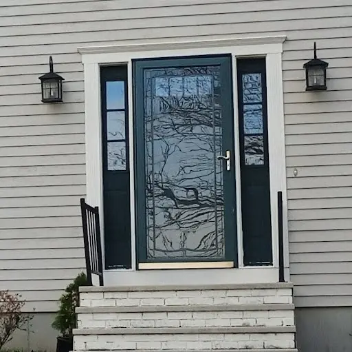 Black decorative front entry before the white entry and custom trim transformation